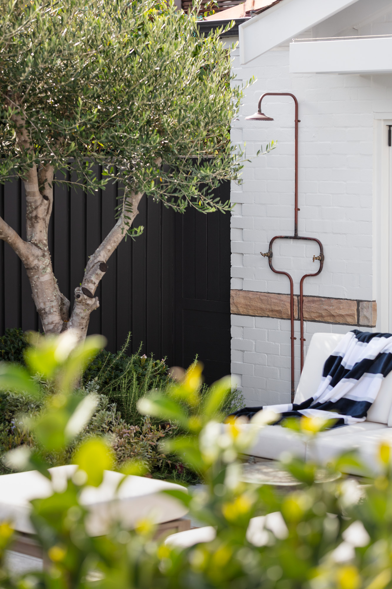 This outdoor shower is both elegant and practical.