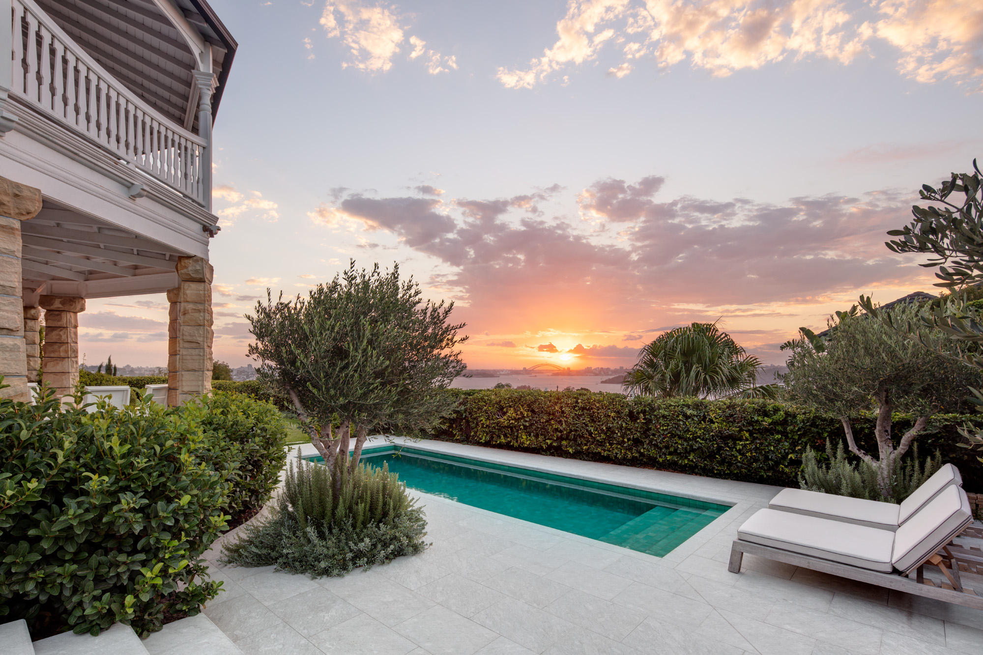 Rectangular pool with limestone coping is at home amongst architecture and environment.