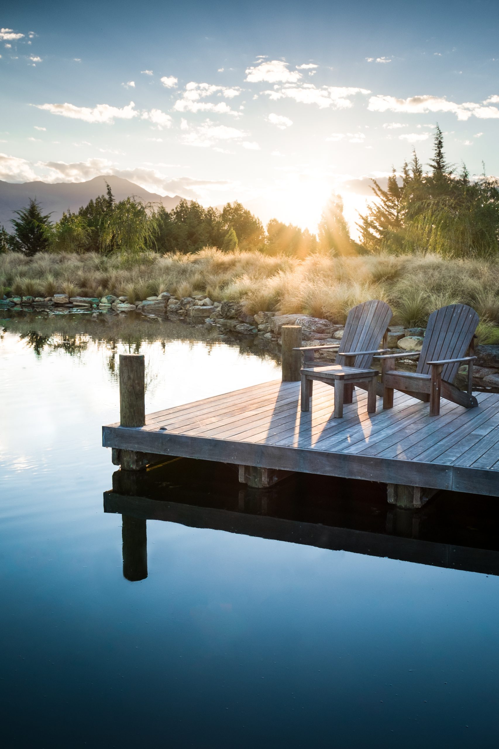 A timber jetty provides an idyllic location to watch the sunset. Photo by Wyer & Co. | Landscape Design on September 04, 2019.