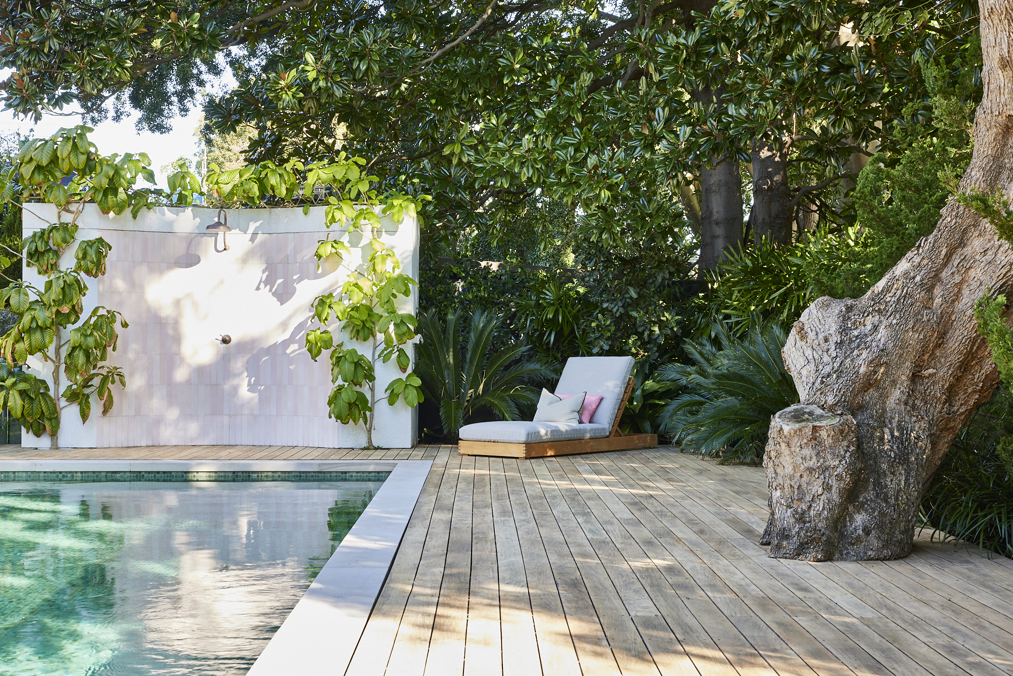 Beautiful Pink tiled outdoor Shower, framed by lush garden, accenting pool Photo by Wyer & Co. | Landscape Design in Rose Bay, New South Wales with @onsitesupplyanddesign.